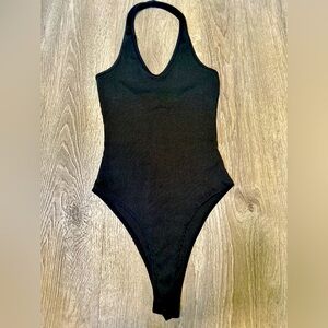 Black halter top bodysuit from SHEIN. Size small. Perfect for versatile styling.